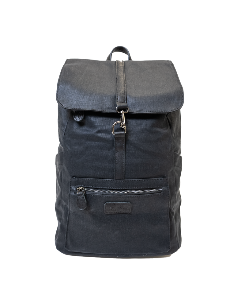 Introducing the Sick Backpack by SourStrips: a sleek black backpack with a flap cover secured by a sturdy metal clasp and strap. It includes a convenient front zipper pocket and side pockets. Made from durable fabric, this minimalist design combines functionality with style.