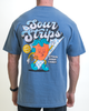 A person sports the Retro Strawberry Tee by SourStrips, featuring a cartoon strawberry character with sunglasses, headphones, and sneakers. The unisex design includes the phrases "Sour Strips" and "Actual Sour Candy," plus a speech bubble reading "Good Vibes Only.