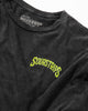 The SourStrips Twisted Temptation Tee is a black unisex cotton shirt featuring bold yellow-green "SOURSTRIPS" text on the chest, with "LARGE" and "A CULTURE DRIP" on the collar tag, laid flat on a white surface.