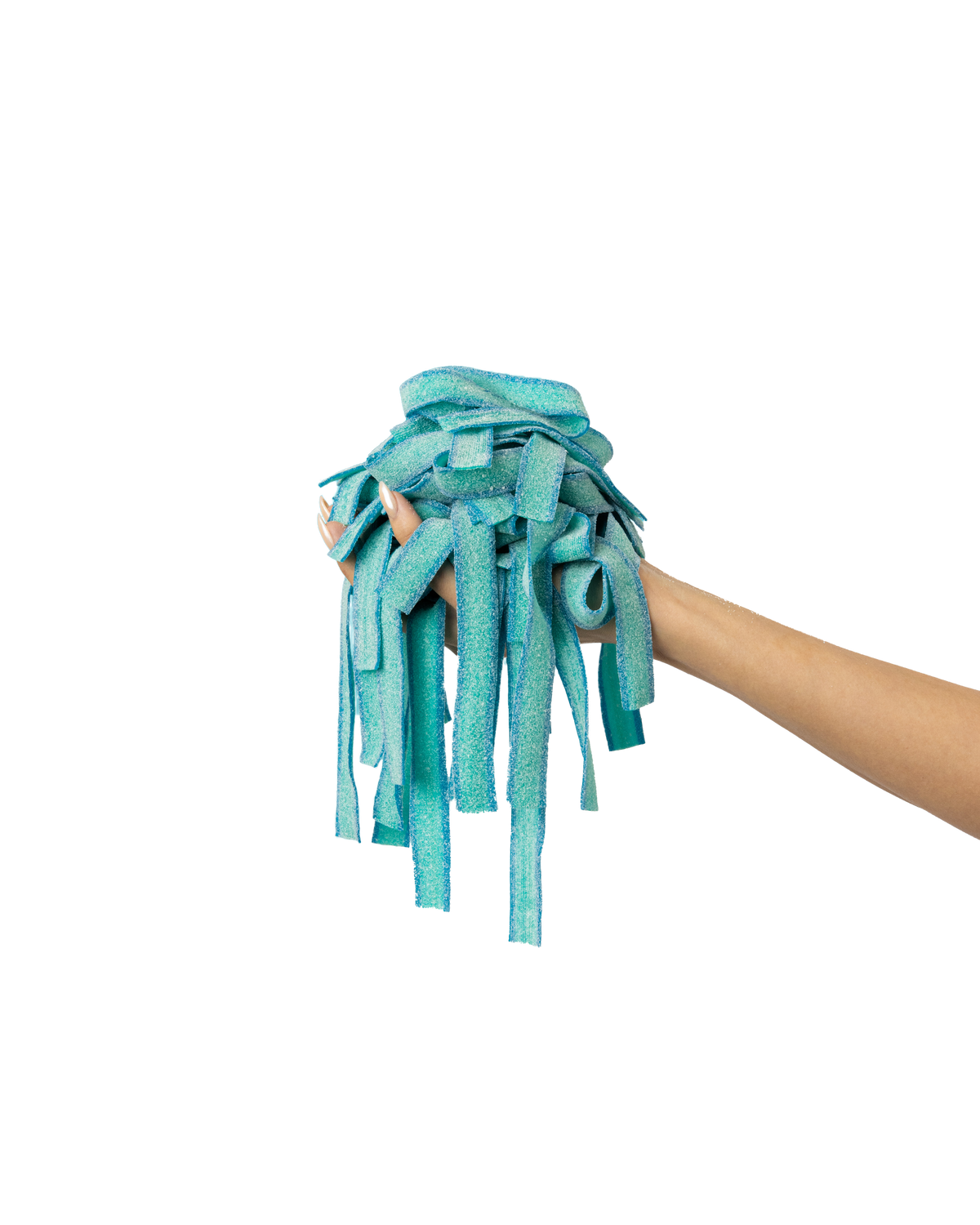 A hand is holding a bundle of blue, ribbon-like strips against a gradient blue background. The strips resemble colorful candy or fabric.